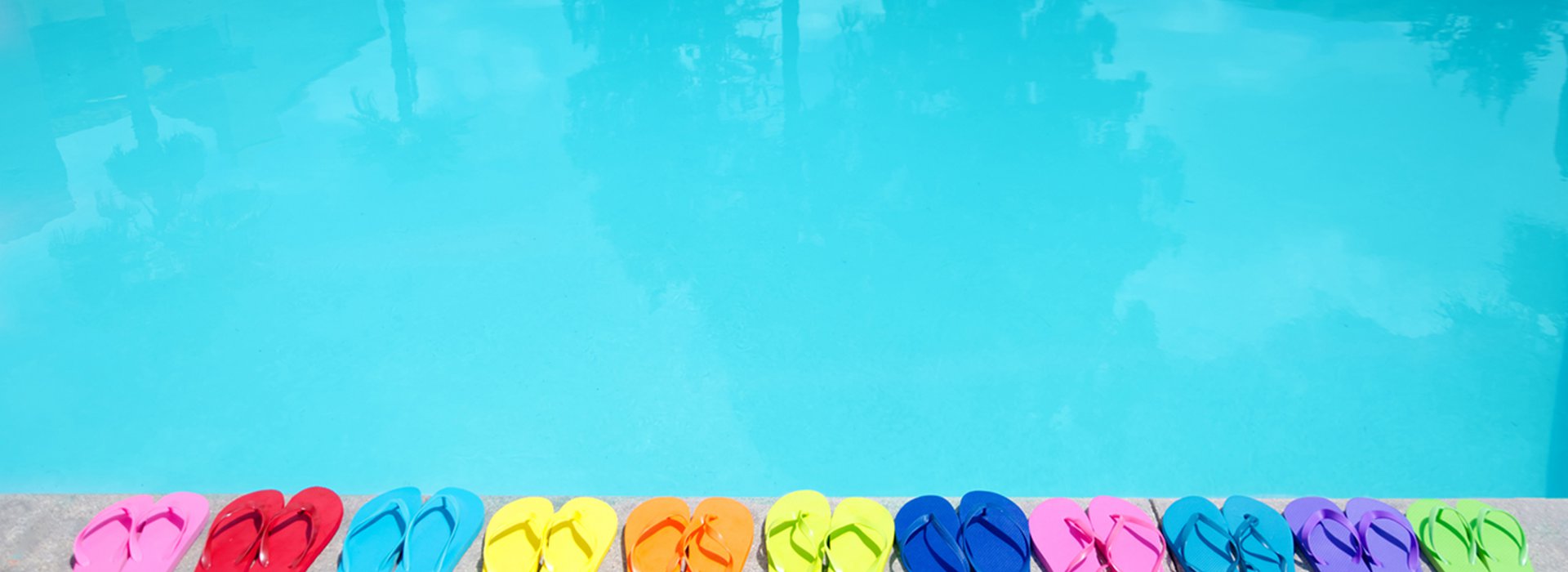 Color flip flops by the pool